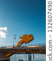 Golden Dragon Bridge over Han River in Da Nang at sunset, Iconic Vietnamese landmark spanning urban waterway with city skyline view 132607490
