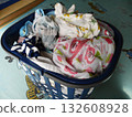 Clothes in a laundry basket before drying 132608928
