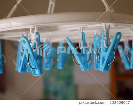 Clothespins on a corner hanger 132609007