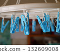 Clothespins on a corner hanger 132609008