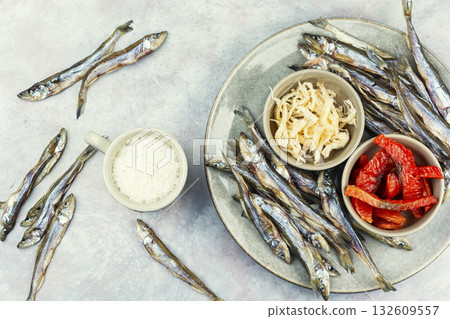 Beer and assorted dried fish 132609557