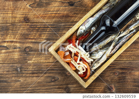 Beer and dried fish. 132609559