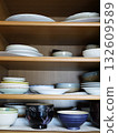 Dishes stored in the cupboard 132609589