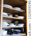 Dishes stored in the cupboard 132609590