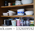 Dishes stored in the cupboard 132609592