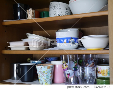 Dishes stored in the cupboard 132609592
