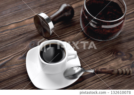 coffee in a cup ground coffee in a glass jar, temper wooden natural background coffee in a cup ground coffee in a glass jar, temper wooden natural background 132610078