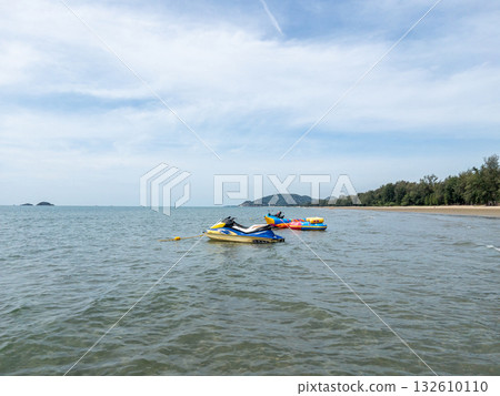 Jet Ski and Banana Boat for Tourist Water Activities at Tropical Beach. Jet Ski and Banana Boat for Tourist Water Activities at Tropical Beach. 132610110
