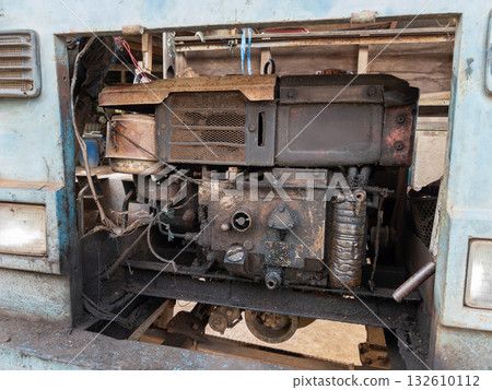 Old Agricultural Truck Engine with Rust and Grease Marks. 132610112