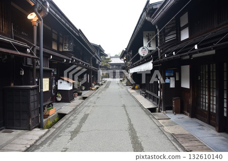 Old townscape of Takayama City, Gifu Prefecture, Japan. Old houses exuding a sense of history. Morning scene during the Takayama Spring Festival. Old townscape of Takayama City, Gifu Prefecture, Japan. Old houses exuding a sense of history. Morning scene during the Takayama Spring Festival. 132610140