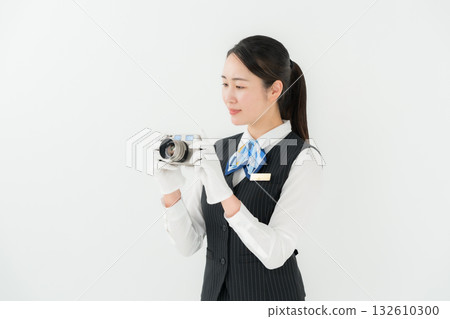 Woman in uniform, business, appraisal, camera Woman in uniform, business, appraisal, camera 132610300