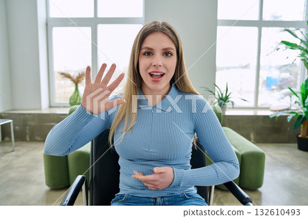 Web cam view of young woman talking looking in camera, online meeting, video call 132610493