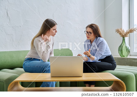 Young female patient during psychotherapy session with psychologist 132610507