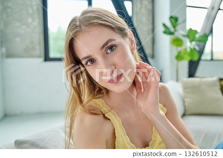 Close-up selfie portrait of teenage female looking at web camera Close-up selfie portrait of teenage female looking at web camera 132610512