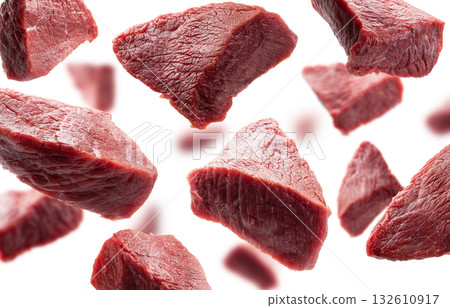 Pieces of fresh meat levitate on a white background Pieces of fresh meat levitate on a white background 132610917