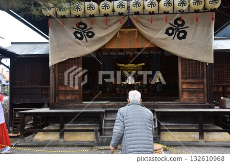 Takayama City, Gifu Prefecture, Japan - Hie Shrine Otabisho decorated with lanterns, where the gods rest during the spring Takayama Festival. Worshippers. Takayama City, Gifu Prefecture, Japan - Hie Shrine Otabisho decorated with lanterns, where the gods rest during the spring Takayama Festival. Worshippers. 132610968