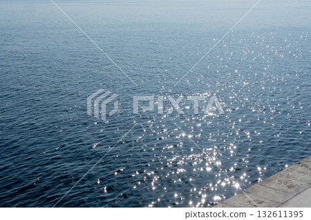 beautiful view of the water in the sea sparkling in the sun's rays beautiful view of the water in the sea sparkling in the sun's rays 132611395
