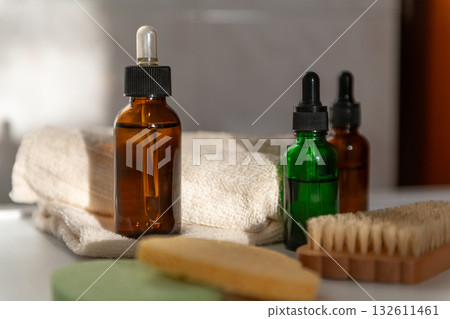 Amber glass dropper bottles in bathroom on sunshine 132611461