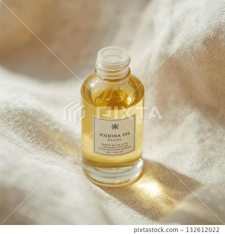 White towel and jojoba oil 132612022