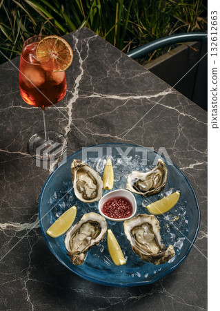 fresh galician raw oysters on ice in gourmet vigo restaurant table in spain fresh galician raw oysters on ice in gourmet vigo restaurant table in spain 132612663
