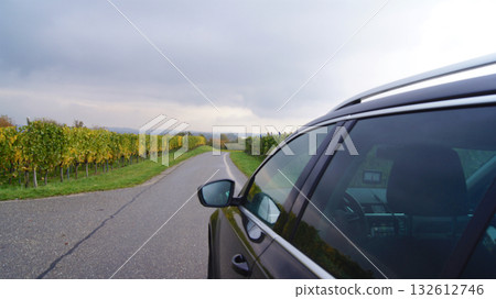 Lindau, Germany, October 16, 2015: Black Station Wagon Driving through Vineyards on Mainau Island 132612746