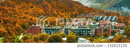 A small town with houses and trees in the background A small town with houses and trees in the background 132613138