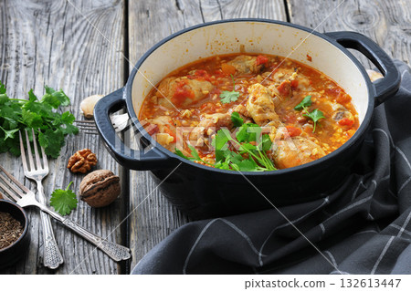 Chakhokhbili, Georgian chicken stew in a pot 132613447