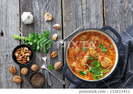Chakhokhbili, Georgian chicken stew in a pot Chakhokhbili, Georgian chicken stew in a pot 132613451