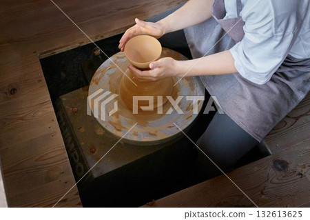 The hands of a young man enjoying pottery 132613625