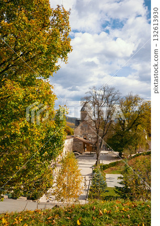 A beautiful autumn day with a church in the background A beautiful autumn day with a church in the background 132613930