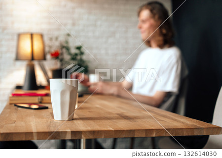 Coffee brewing conversation in a cozy cafe setting during afternoon hours 132614030