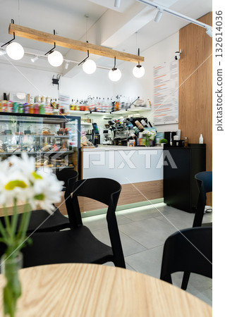 Cozy cafe interior with counter and bright lighting during the day 132614036