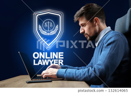 Professional lawyer working on a laptop in a modern office setup for online consultations 132614065