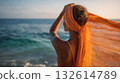 Woman enjoying sunset at the beach 132614789
