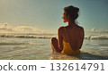 Woman enjoying sunset at the beach 132614791