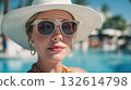 Woman enjoying summer by the pool 132614798