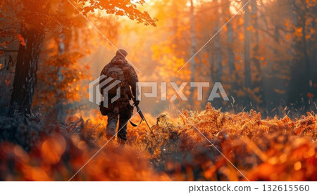 A man hikes through a leafcovered forest floor in a woodland ecoregion A man hikes through a leafcovered forest floor in a woodland ecoregion 132615560
