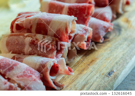 Close-up of the layers and color details of a frozen beef slice roll. Close-up of the layers and color details of a frozen beef slice roll. 132616045