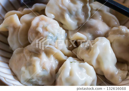Traditional Asian dumplings served on a plate Traditional Asian dumplings served on a plate 132616088