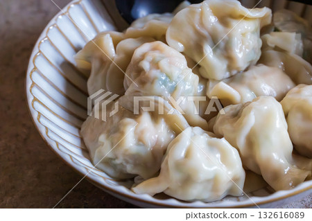 Traditional Asian dumplings served on a plate 132616089