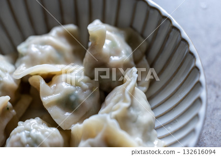 Traditional Asian dumplings served on a plate Traditional Asian dumplings served on a plate 132616094