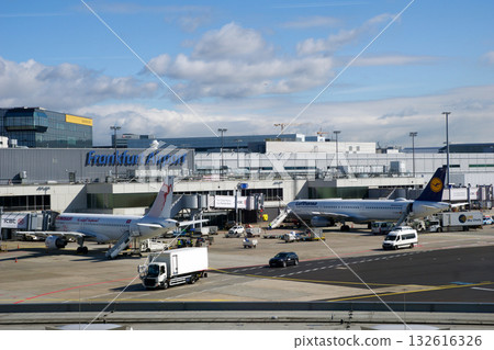 Frankfurt, Germany, September 13, 2019: Short-Haul Aircraft and Ground Vehicles at Frankfurt Airport Frankfurt, Germany, September 13, 2019: Short-Haul Aircraft and Ground Vehicles at Frankfurt Airport 132616326