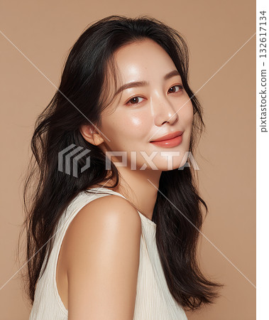 A woman with a healthy and friendly expression, surrounded by soft light 132617134