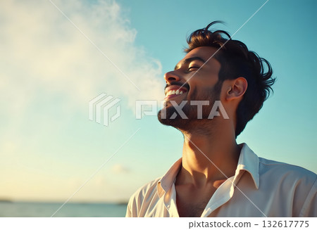 An attractive man breathes fresh air from nature at sunset. Healthy lifestyle and emotional well-being An attractive man breathes fresh air from nature at sunset. Healthy lifestyle and emotional well-being 132617775