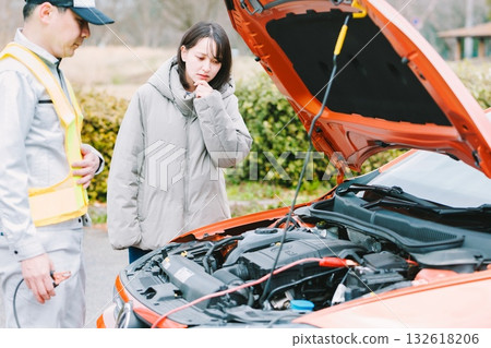 Female driver who called road service due to car breakdown Female driver who called road service due to car breakdown 132618206