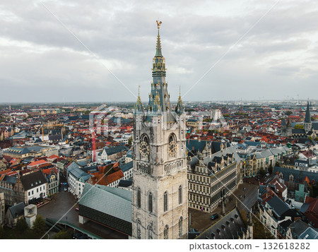 Aerial panorama of Ghent featuring the iconic Belfry tower and the rooftops of the old city. 132618282