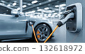 Power supply for electric car charging. Electric car charging station. Close up of the power supply plugged into an electric car being charged. 132618972
