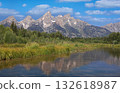 Teton Range reflecting in Snake River at Schwabacher Landing at Grand Teton National Park in Wyoming, USA 132618987