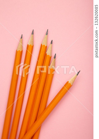 Graphite pencil with eraser on pink background. School stationery 132620085