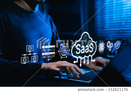 SaaS cloud computing and software service technology. Man using laptop with SaaS and cloud icon, represent Software as a Service, cloud infrastructure, data processing digital platform-based solutions SaaS cloud computing and software service technology. Man using laptop with SaaS and cloud icon, represent Software as a Service, cloud infrastructure, data processing digital platform-based solutions 132621176